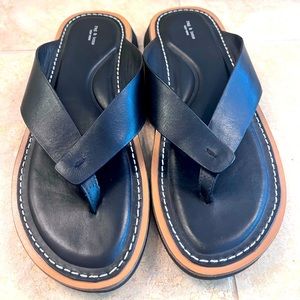Black leather rag & bone flip flops.
